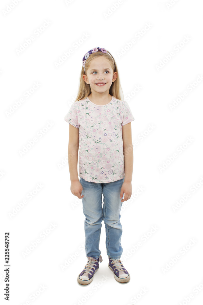 Portrait of a happy little girl full length. Isolated on white background
Portrait of a happy little girl full length. Isolated on white background