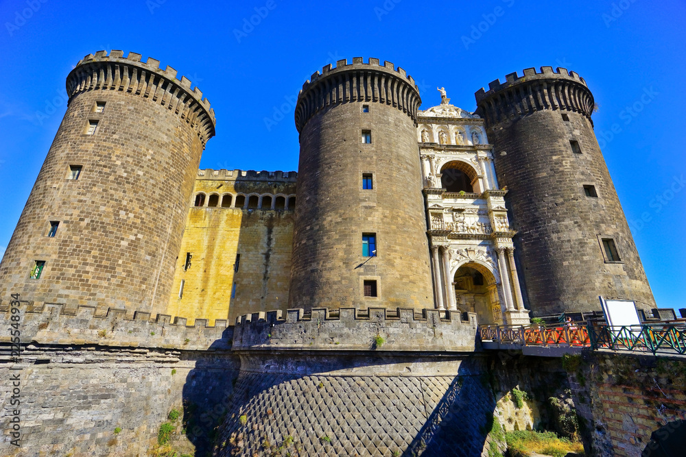 View of the Castel Nuovo near the seaside in Naples, Italy.