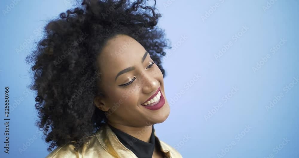 Beautiful girl lifestyle video concepts. Afro american girl posing on colored backgrounds Beautiful girl lifestyle video concepts. Afro american girl posing on colored backgrounds