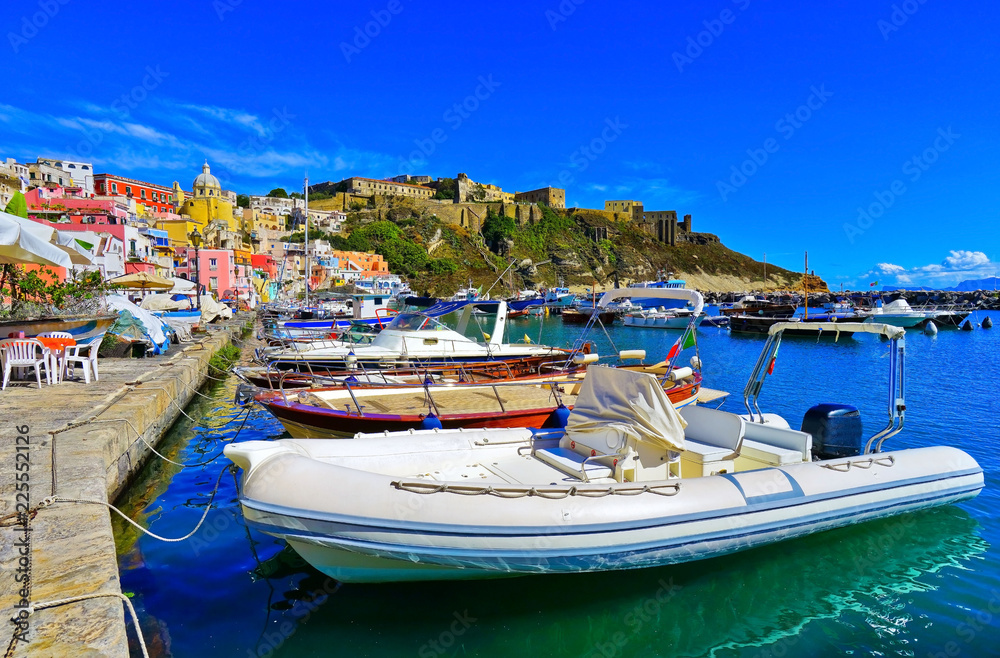 View of the colorful houses at the Port of Corricella in Procida Island, Italy.