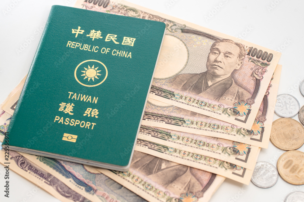 Fototapeta premium Japanese yen banknotes, Japanese yen coin and ROC Taiwan passports