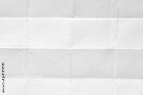 The texture of white paper with kinks. Background of crumpled cardboard.