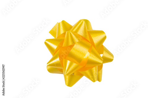 Yellow gift wrap bow top view on white background