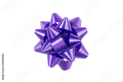 Purple gift wrap bow top view on white background