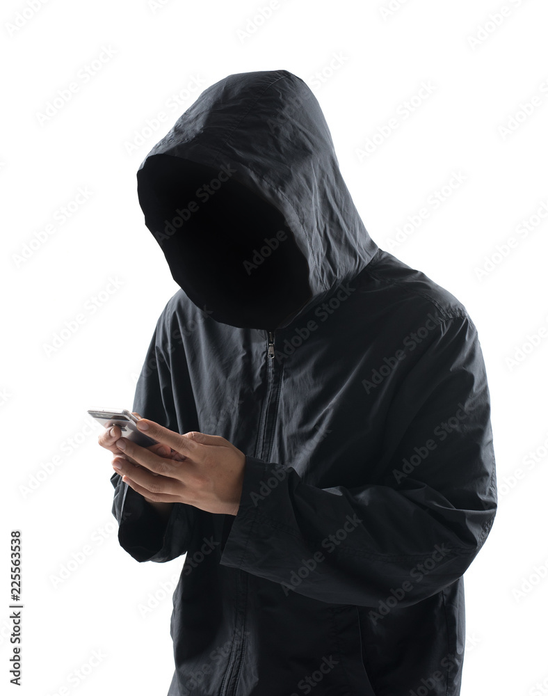 Hacker with hidden face in a hoodie uses a mobile phone to hack the system  isolated on white background foto de Stock | Adobe Stock