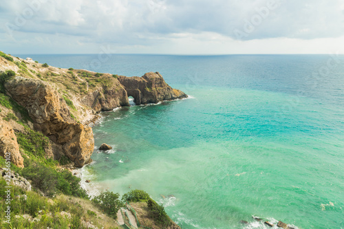 View of the sea from the cliff. Blue bay