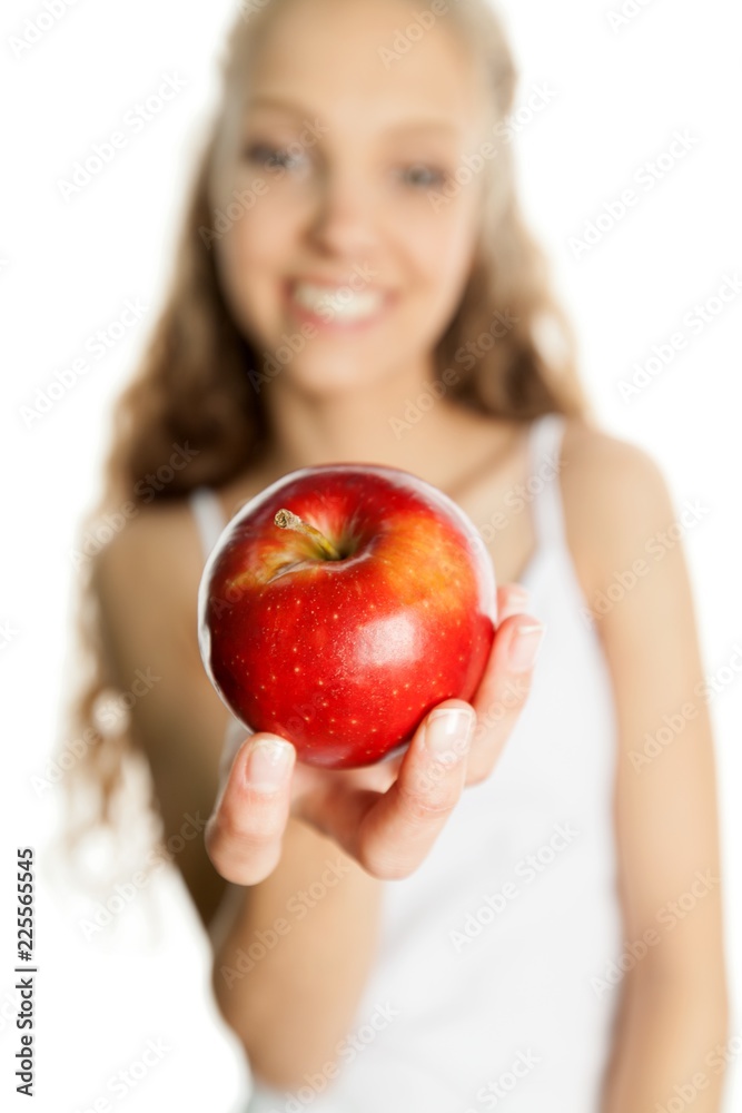 Closeup of a Young Woman Showing an Apple Closeup of a Young Woman Showing an Apple