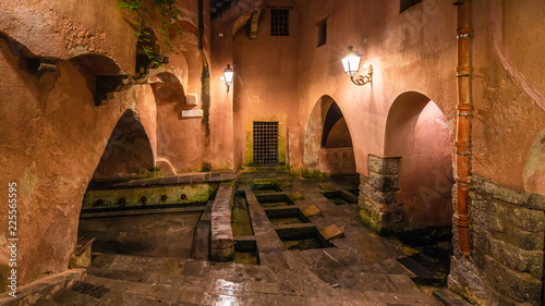 The famous public ancient roman baths on Cefalu, Sicily island, Italy photo