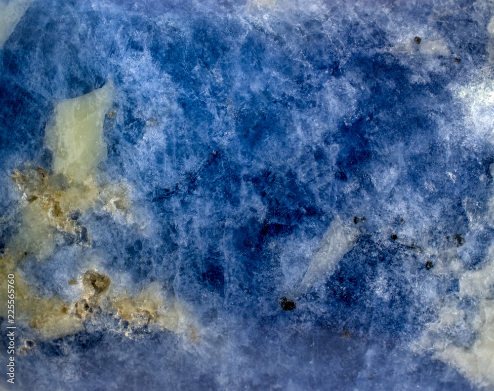 Stone texture background. Polished sodalite gemstone surface macro.