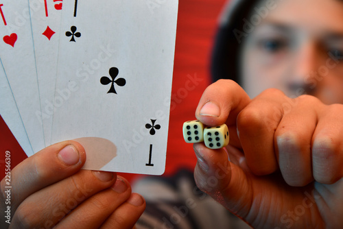 Playing cards or dice, the right choice on a red background.