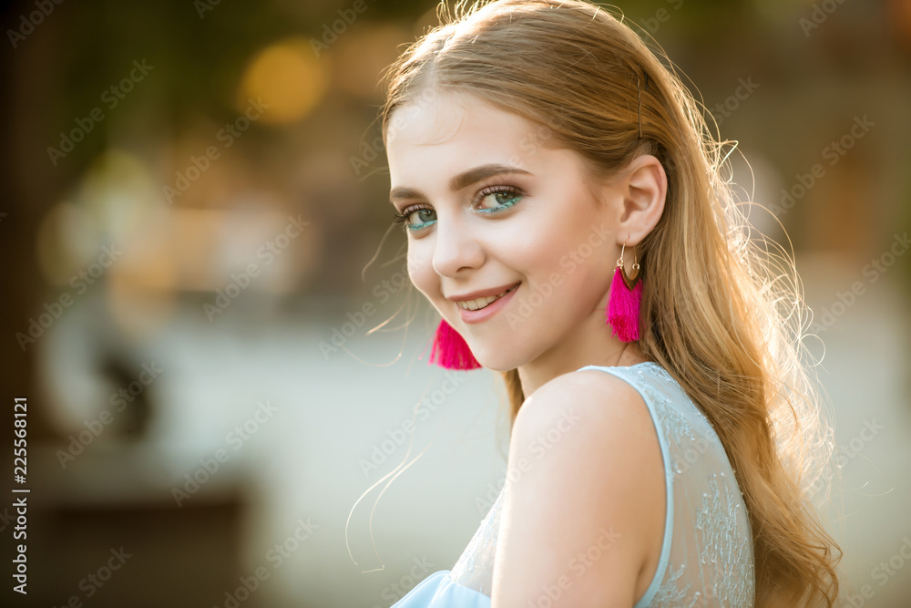 happy woman with stylish makeup and long blonde hair. summer fashion woman. Perfect female. Beauty and fashion look of model. Pretty girl with fashionable hair and earrings. Confident in her choice happy woman with stylish makeup and long blonde hair. summer fashion woman. Perfect female. Beauty and fashion look of model. Pretty girl with fashionable hair and earrings. Confident in her choice