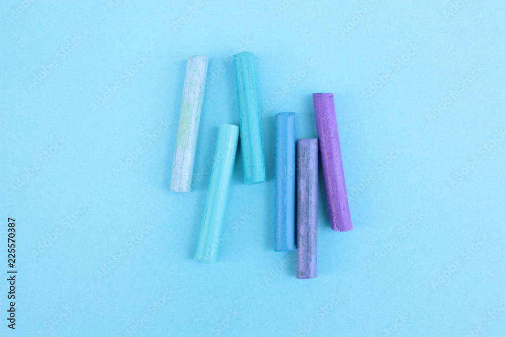 Colored pastel on a blue background Colored pastel on a blue background