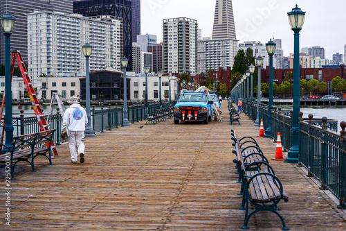 SAN FRANCISCO, CALIFORNIA, USA - MAY 14, 2018: SAN FRANCISCO, CALIFORNIA, USA - MAY 14, 2018: Pier 7 at the Embarcadero. City Service is the prevention of the operation of lamps photo