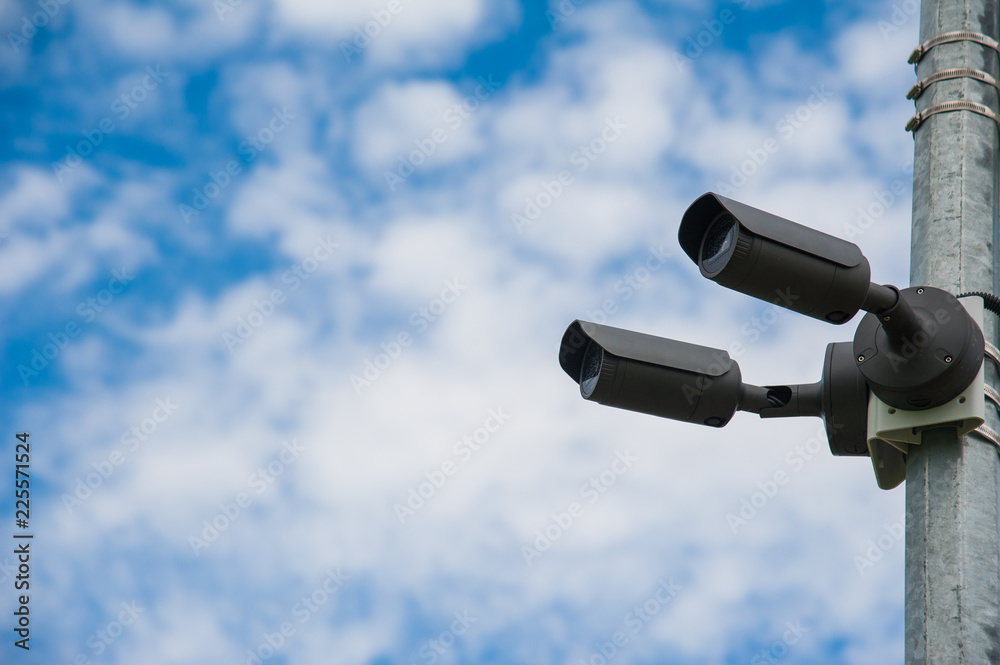 Modern CCTV camera. Concept of surveillance and monitoring Modern CCTV camera. Concept of surveillance and monitoring