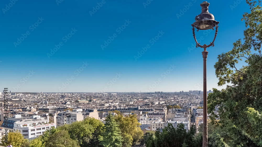 Paris, panorama of the city, from Montmartre hill, with a vintage lamppost
