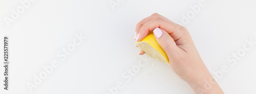 Woman hand with lemon
