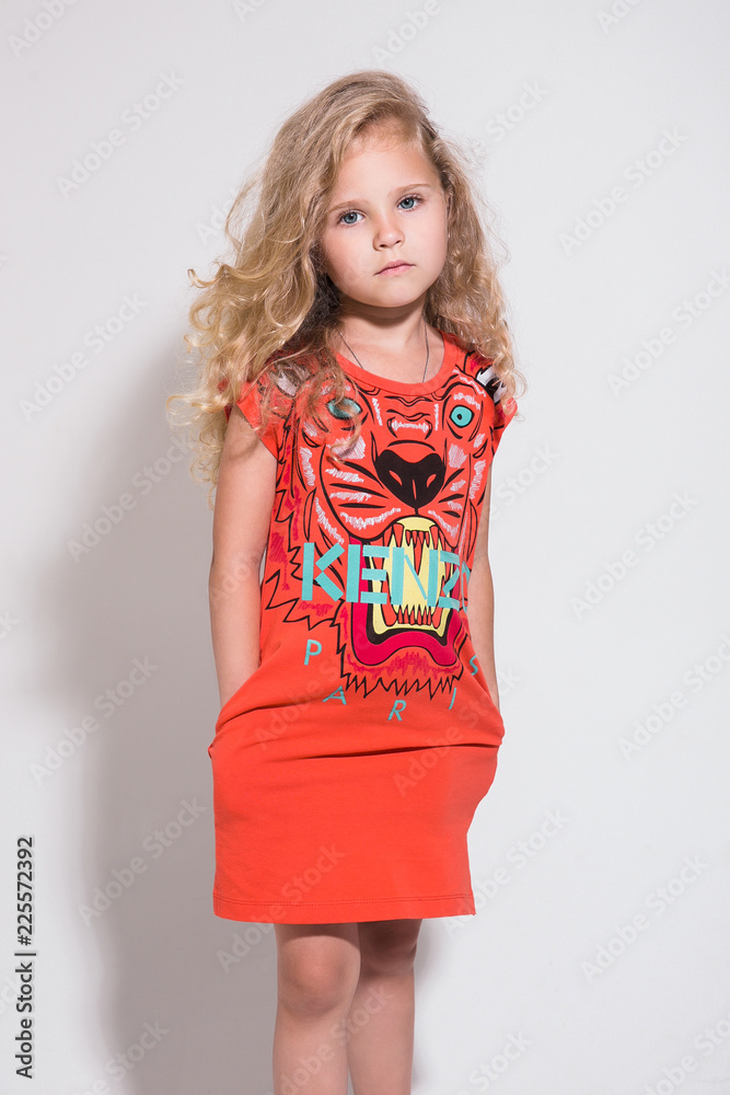 Young fashion model on a white background, child portrait Young fashion model on a white background, child portrait