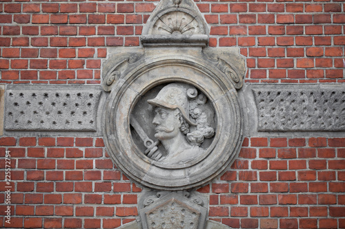 Ornaments, moldings, gargoyle, low reliefs in a sandstone, granite, concrete. sculpting details in Gdansk (Danzig). photo