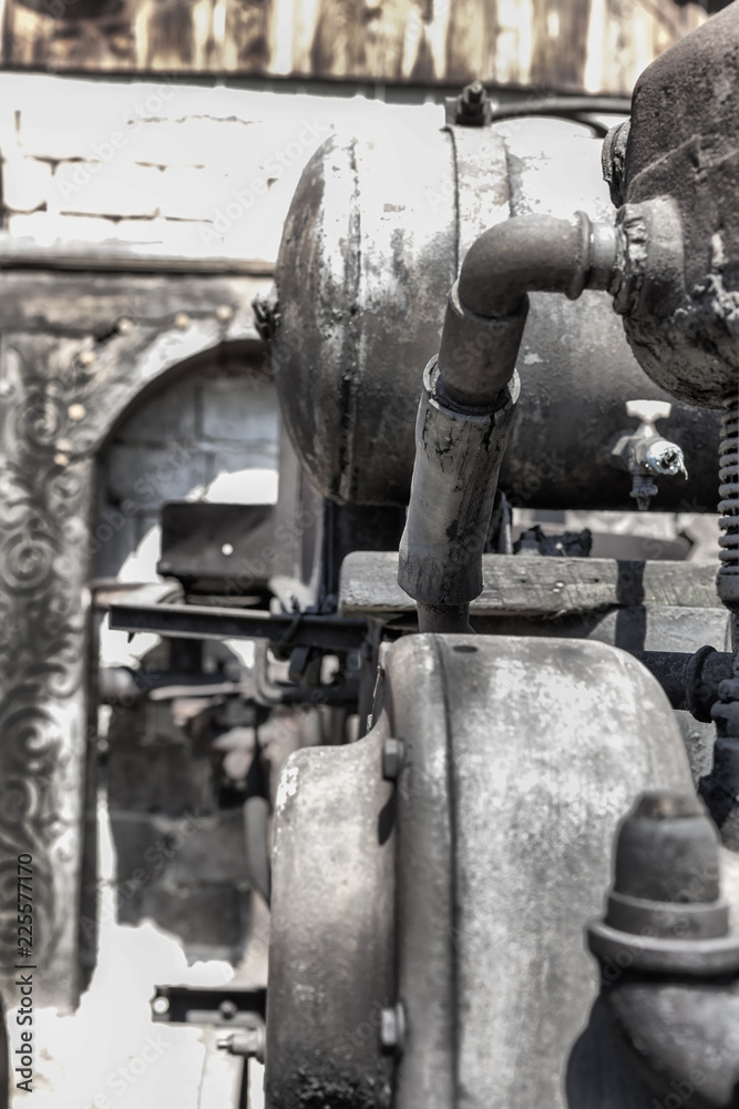 Details on an old tresher engine in Cernat village, Transylvania, Romania. Old machines, old utensils. Hdr image Details on an old tresher engine in Cernat village, Transylvania, Romania. Old machines, old utensils. Hdr image