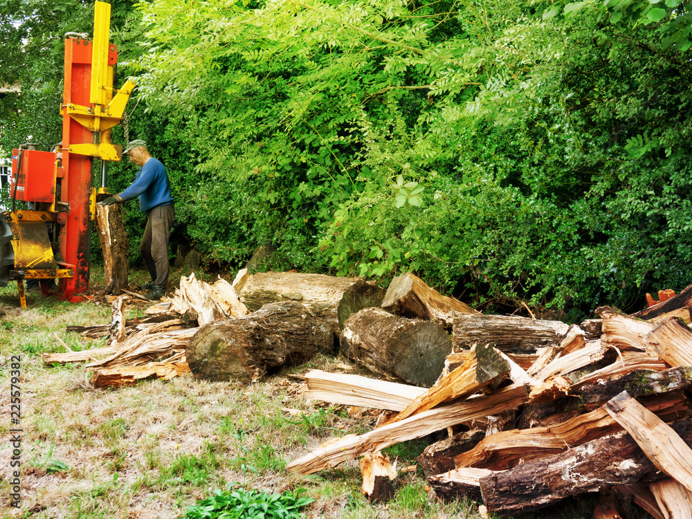 heap of split wood with log splitter heap of split wood with log splitter