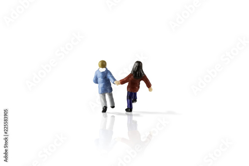 Isolated on white background image of miniature kids running. Clipping Path of the model included