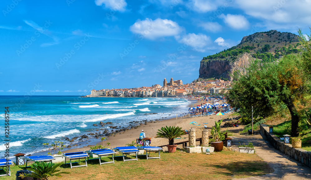 Landscape with beach and medieval Cefalu town on Sicily island, Italy
