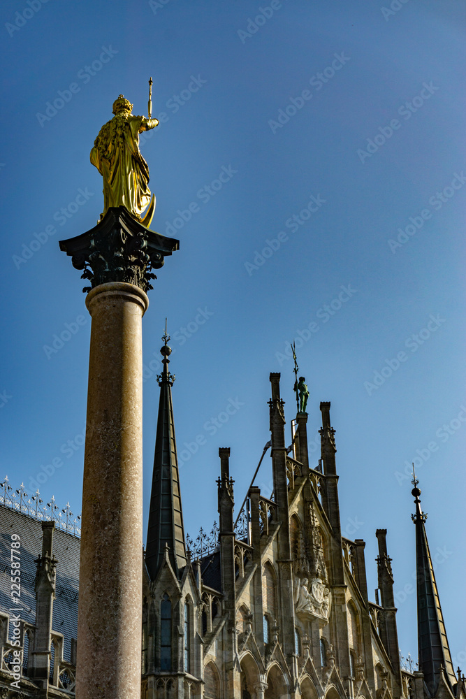 The clock tower of the new City Hall (Rathaus) in Marienplatz is a famous building in Gothic architecture - Munich, Bavaria, Germany, Europe