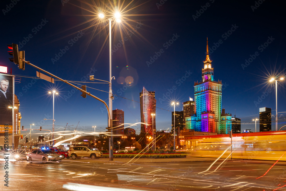 The Palace of Culture and Science and night traffic during rush hour.