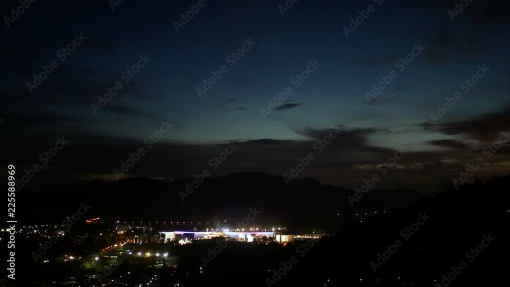 moving colorful spotlight on building and blur defocus light  background in the dark night