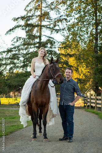 Couple posing with horse