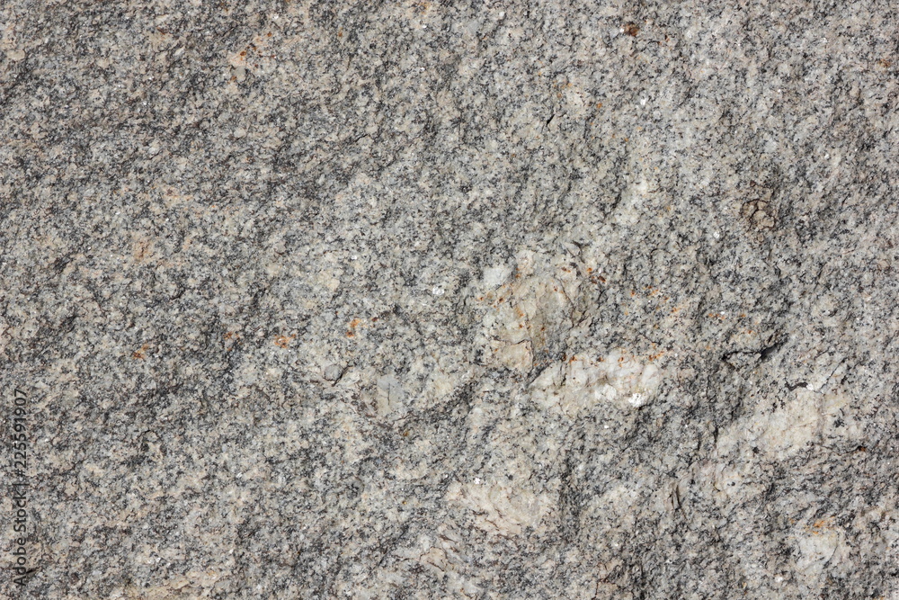 Granite background. Texture of gray granite stone. Natural pattern in gray tones. Abstract background Granite background. Texture of gray granite stone. Natural pattern in gray tones. Abstract background