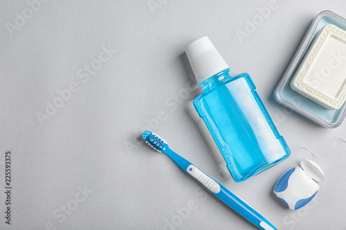 Fototapeta Naklejka Na Ścianę i Meble -  Flat lay composition with oral care products and space for text on light background. Teeth hygiene