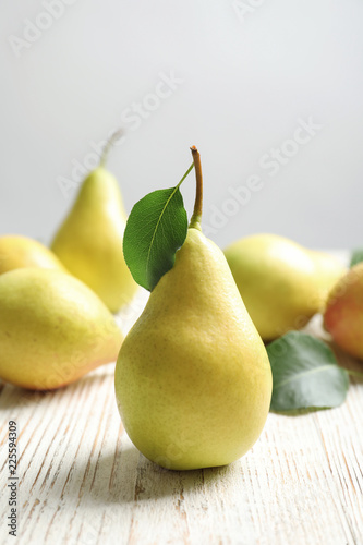 Ripe pears on wooden table. Healthy snack