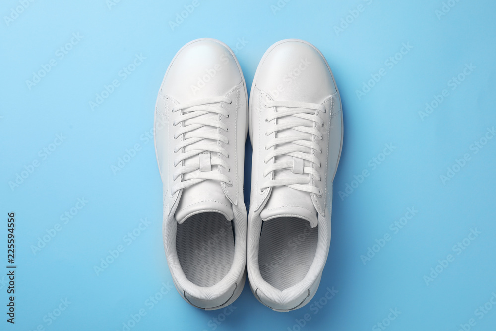 Pair of sneakers on color background, flat lay Pair of sneakers on color background, flat lay
