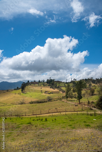 Dirt road bordering a landscape in the countryside in the Boyaca region. Colombia