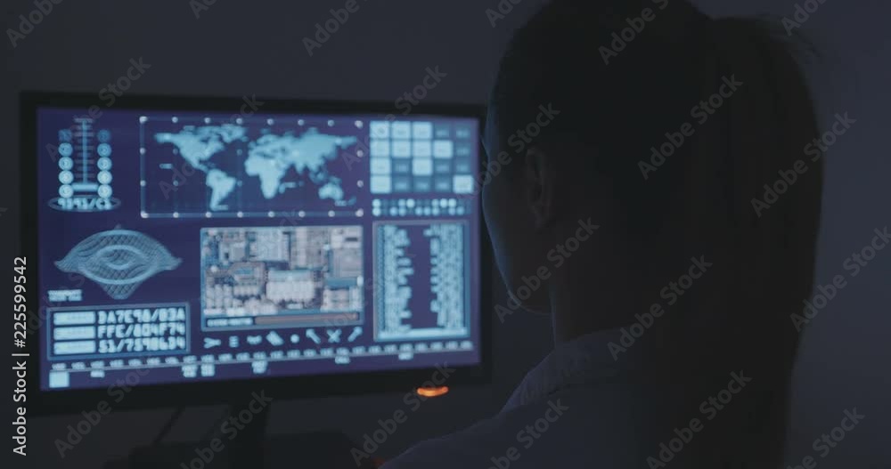portrait of young woman programmer working at a computer in the data center portrait of young woman programmer working at a computer in the data center