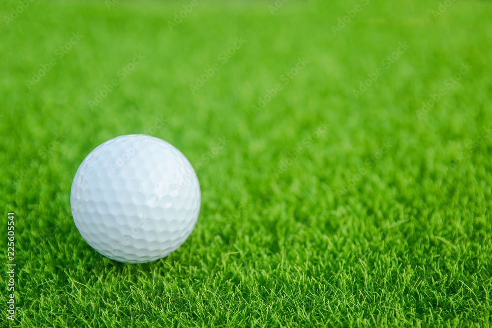 Golf ball on green grass ready to play at golf course. with copy space Golf ball on green grass ready to play at golf course. with copy space