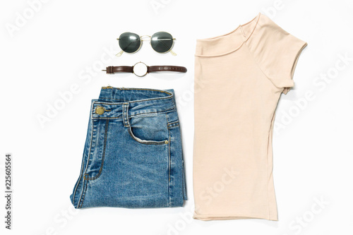 flat lay of woman clothes and accessories set with glasses, watch. Trendy fashion female background.