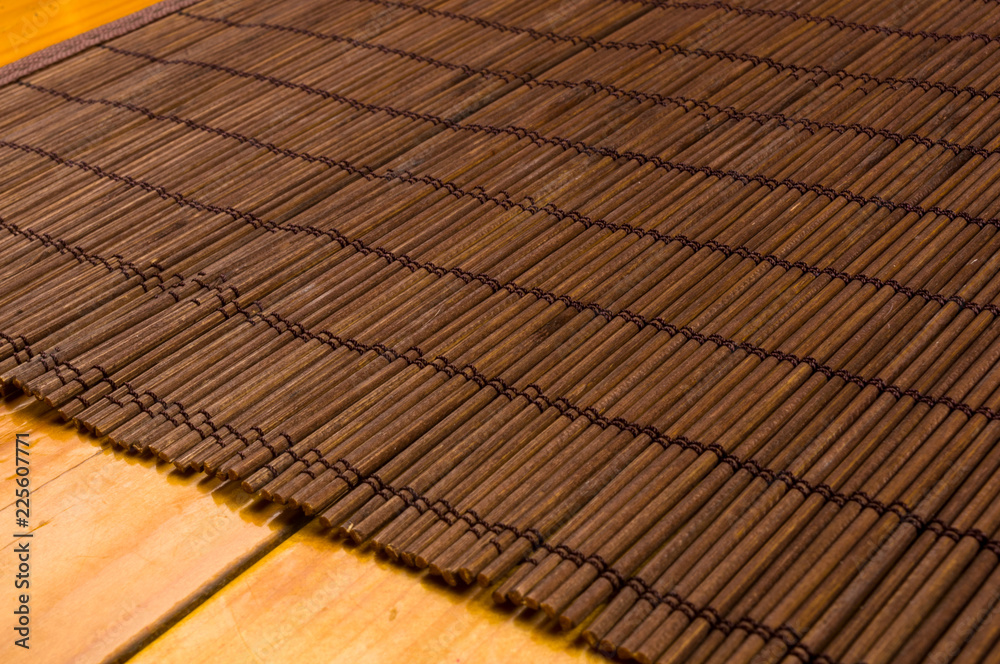 bamboo Mat - stand food, close-up, wooden background bamboo Mat - stand food, close-up, wooden background