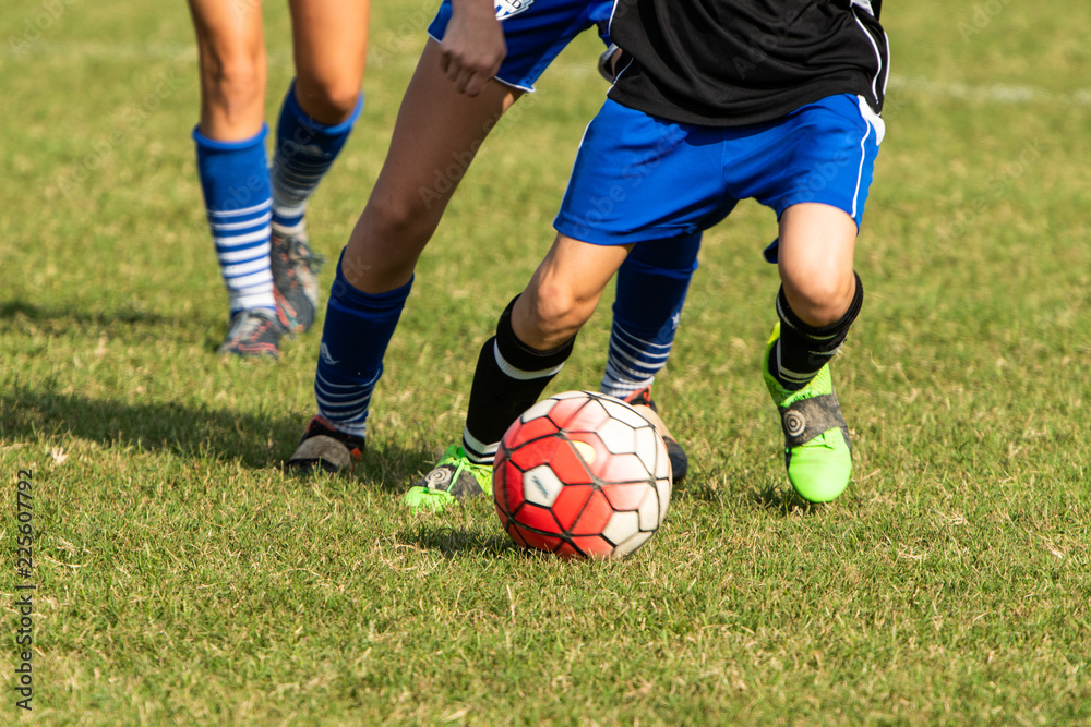 Close up action of youth girls soccer during a competitive match Close up action of youth girls soccer during a competitive match
