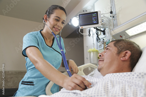 Nurse checking heartbeat with stethoscope.The stethoscope is an acoustic medical device for auscultation, or listening to the internal sounds of an animal or human body.