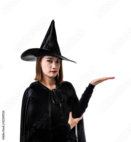Portrait of woman in black Scary witch halloween costume standing with hat isolated on white background © nipastock