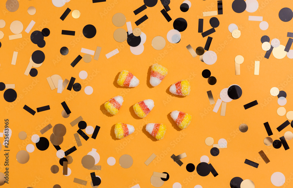 Halloween theme with candies on a orange background