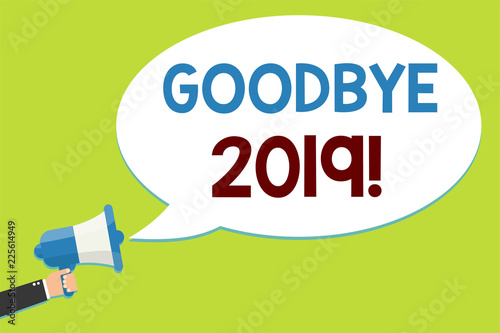 Word writing text Goodbye 2019. Business concept for New Year Eve Milestone Last Month Celebration Transition Man holding megaphone loudspeaker speech bubble message speaking loud photo