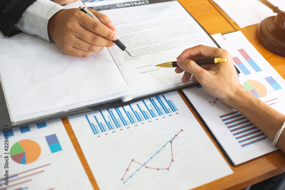 Businessmen are discussing and planning a long-term investment with tax law.power project concept Businessmen are discussing and planning a long-term investment with tax law.power project concept