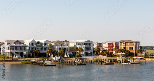Wide angle view of luxury beach rental houses on the intercoastal waterway, Sunset Beach, North Carolina