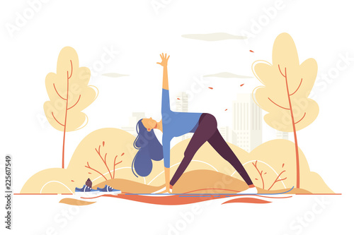 Young girl doing yoga in a park on city background.