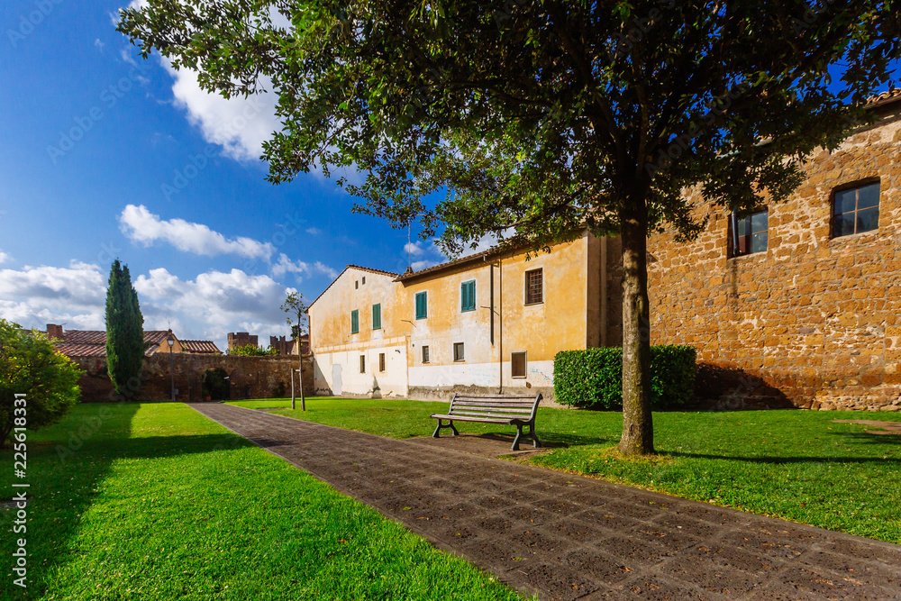 Bench and path in a park in Tuscania, Italy Bench and path in a park in Tuscania, Italy