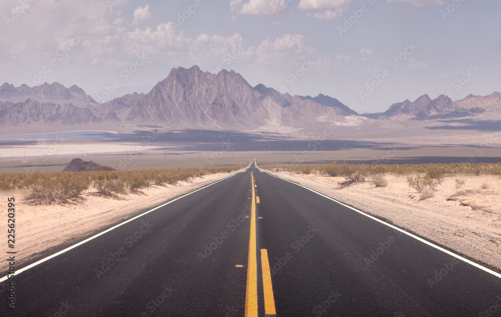 Naklejka premium panoramic view of hot summer road through the Nevada desert