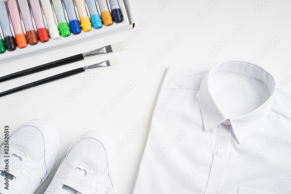 Back to school concept. Arrangement of school uniform. Flat lay or top view Back to school concept. Arrangement of school uniform. Flat lay or top view